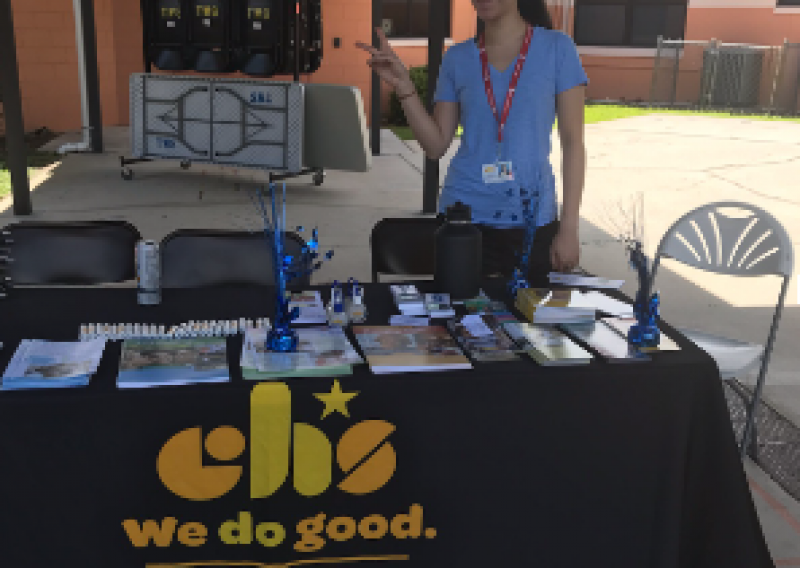 Pictured is Alison Chin tabling at an event for the Childrens' Home Society 