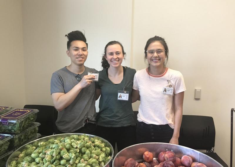 Wesley Ho, Julia Schroeder, and Kristin Lam serving at a food pantry.