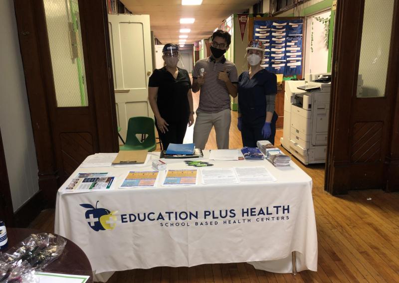 A team prepared for community flu vaccination clinics at Deep Roots Charter School.