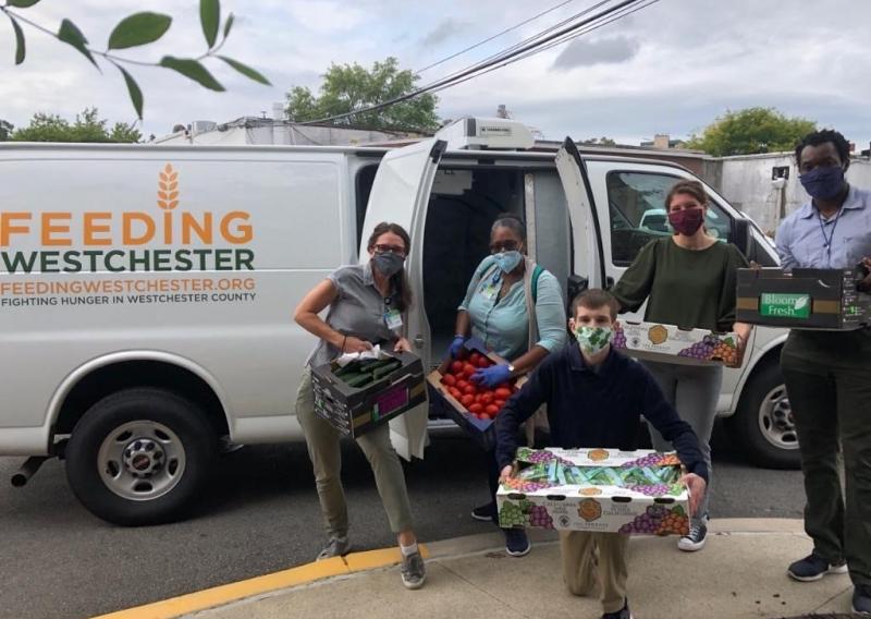 James distributing food for Feeding Westchester.