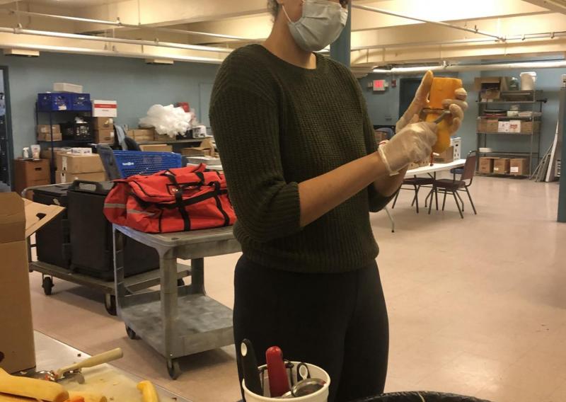 Kathleen helping in preparing meals.