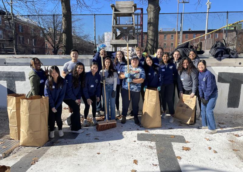 a group photo of NHC members volunteering at a local rec center