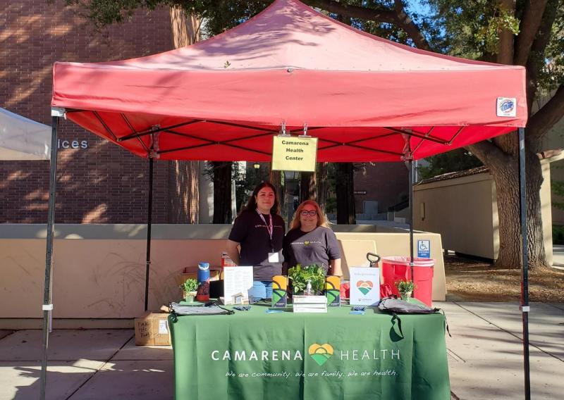 Martha tabling at a fair for Camarena Health