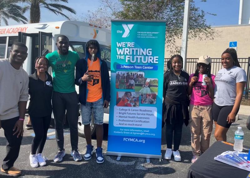 Eliza Leslie is pictured with teens from the Johnson YMCA program