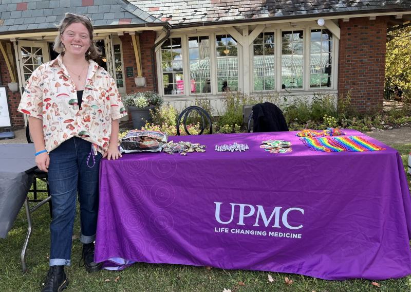 AmeriCorps Member Freya Rolfs of NHC Pittsburgh at a UPMC tabling event.