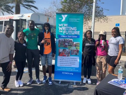Eliza Leslie is pictured with teens from the Johnson YMCA program