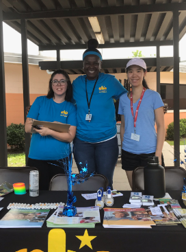 Pictured is Alison and other CHS employees tabling at an event