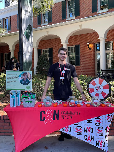 "Younis is pictured tabling at Stetson University to provide information about PrEP and HIV testing. "