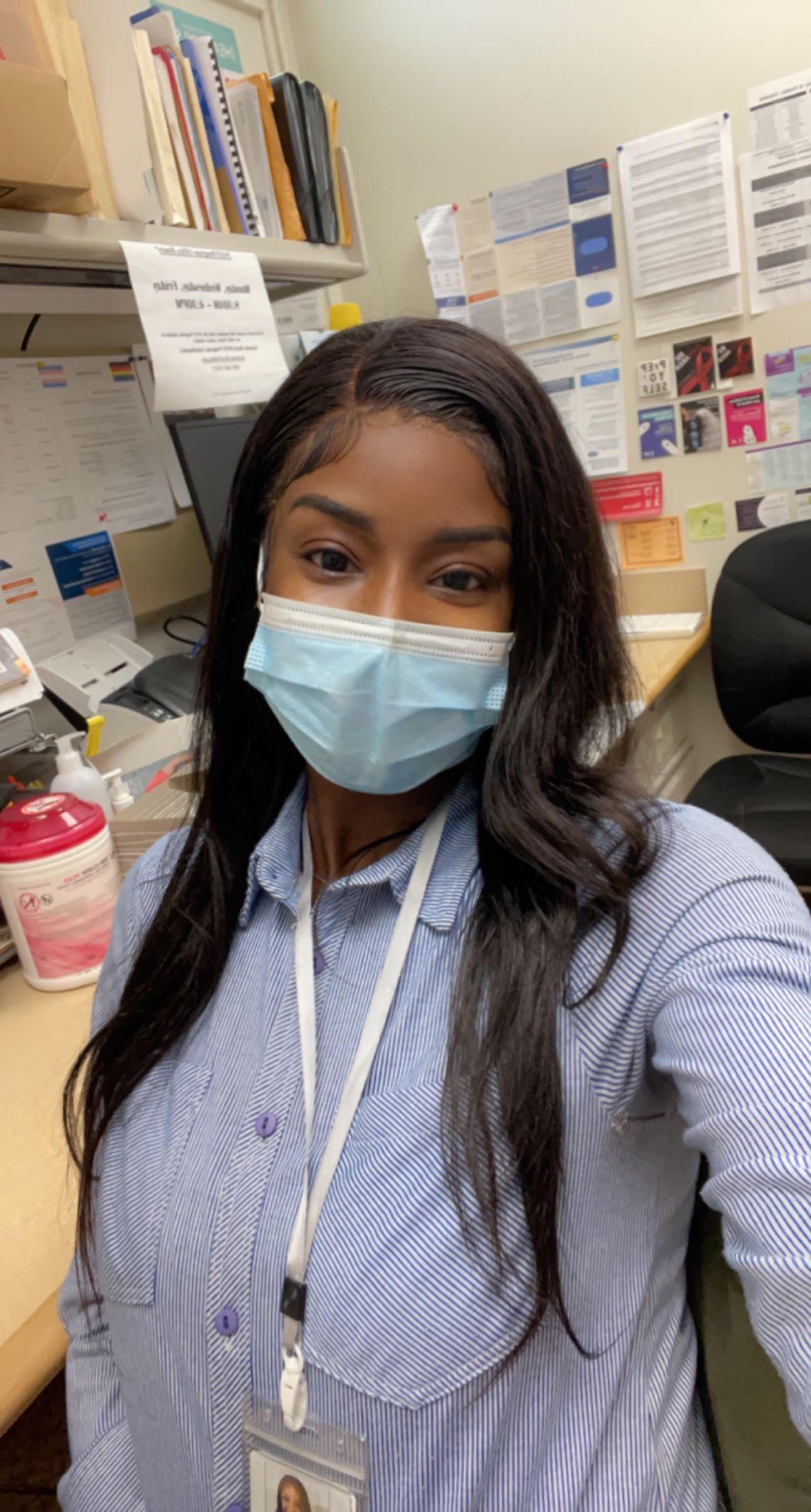 A self of Ami wearing a blue medical mask