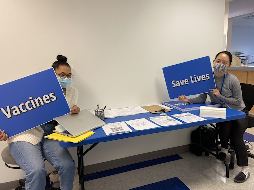 NHC Philly members Flor Cruz-Morillo (left) and Alice Choe (right) operating COVID vaccine clinic